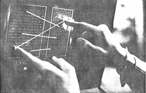 black and white image showing fingers, that are connected throuh white threads.